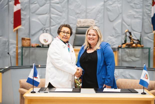 Minister Caitlin Cleveland is sworn in by Commissioner Margaret Thom in December 2023. 